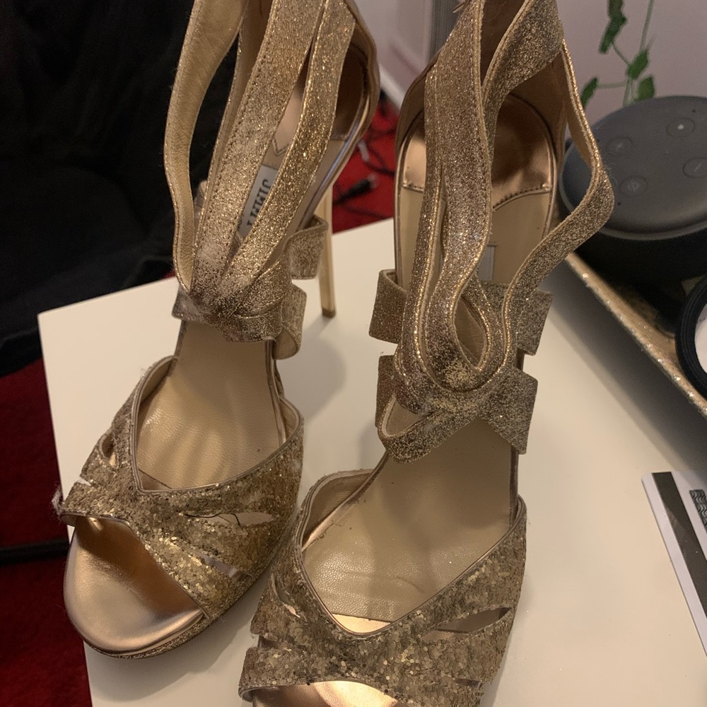 Jimmy choo ladies gold glittered stilettos.